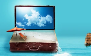 suitcase full of sand with beach umbrella
